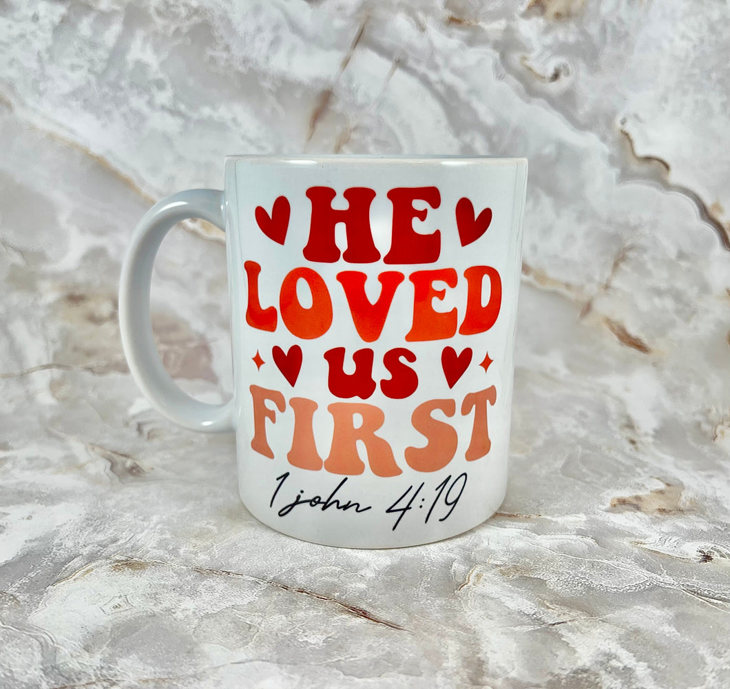 “He Loved Us First” 11oz Mug